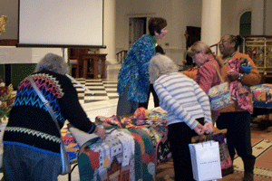 Ami Simms with Some of Her Quilts