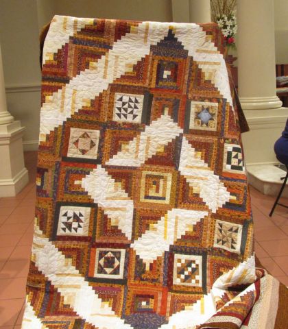 Janice Ewing - Brown and White Log Cabin Quilt