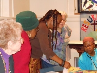 Members discussing Charity Quilts