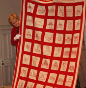 Red and White Quilt with Embroidery
